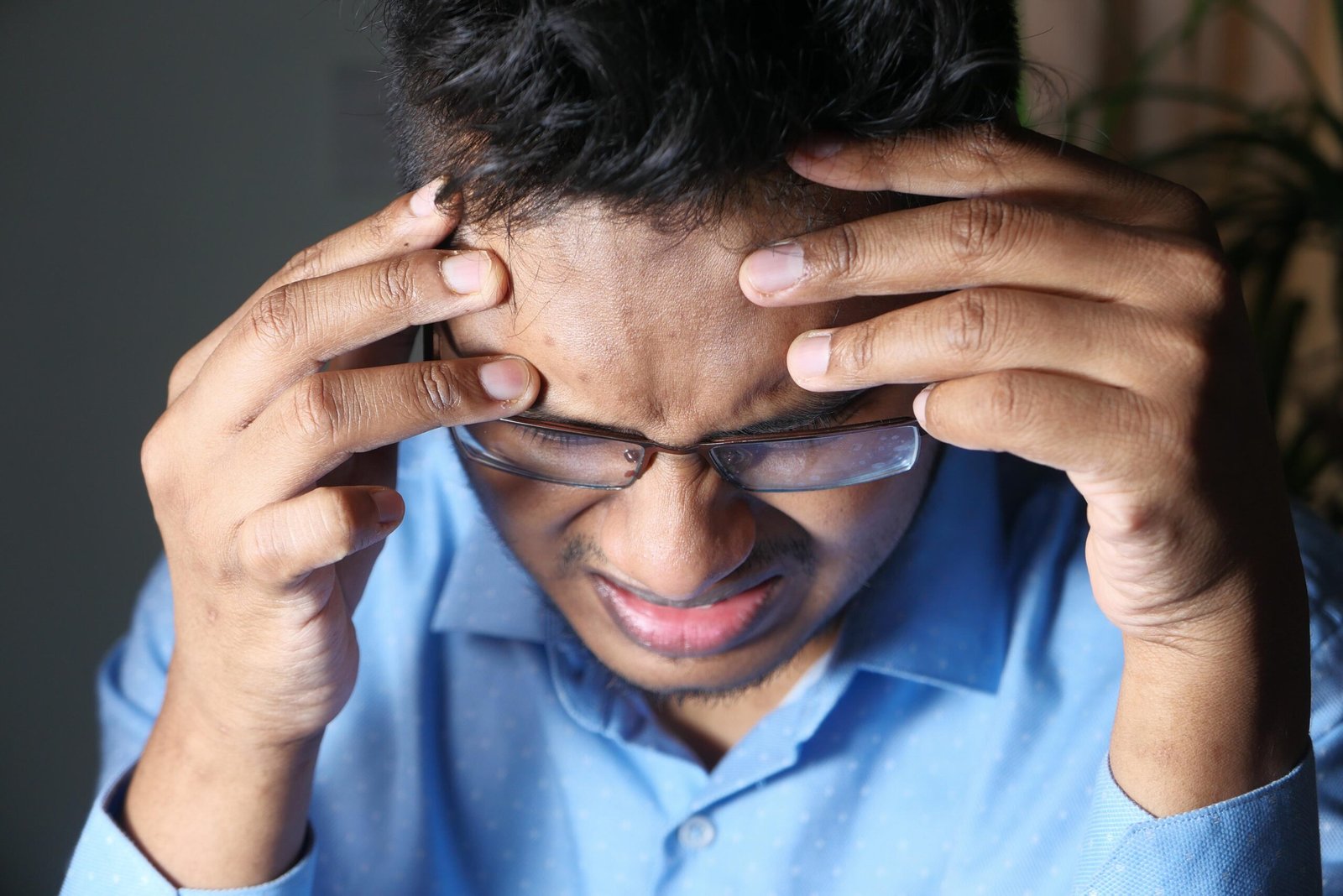 Young man suffering headache