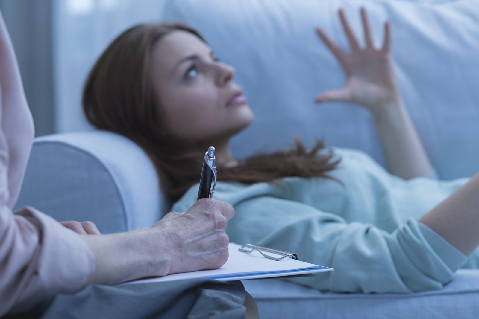 Closeup Of A Therapist Taking Notes About Her Overwhelmed Patient
